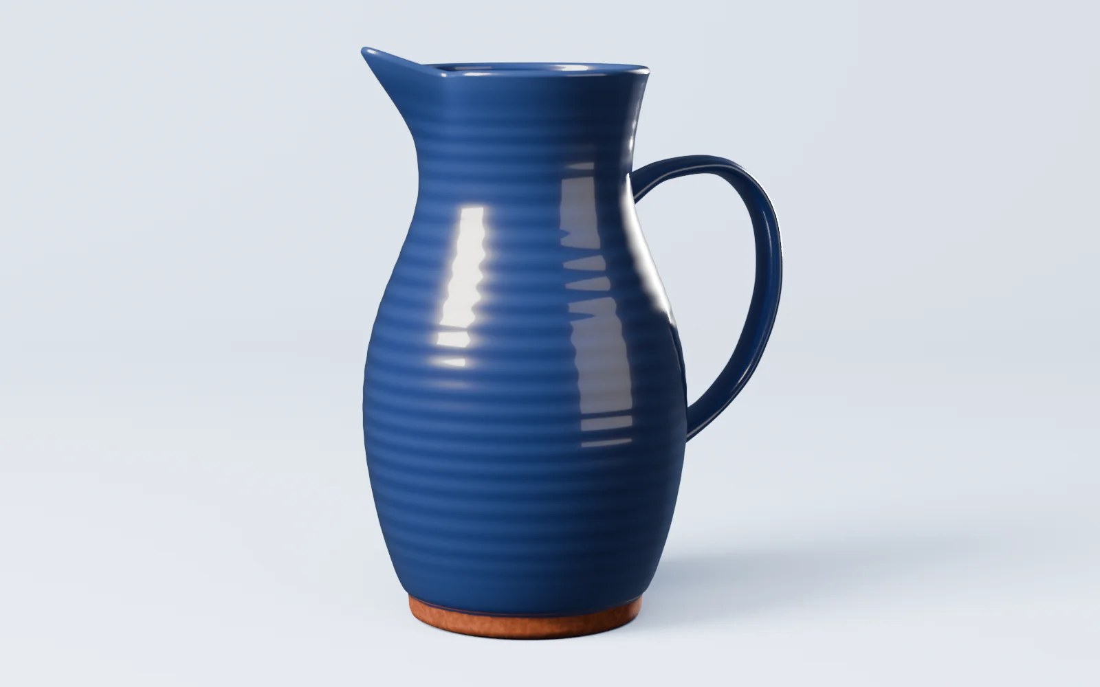 La Brocca Lenta blu cobalto da vicino: beccuccio, ansa, anelli del tornio e piede in terracotta nuda